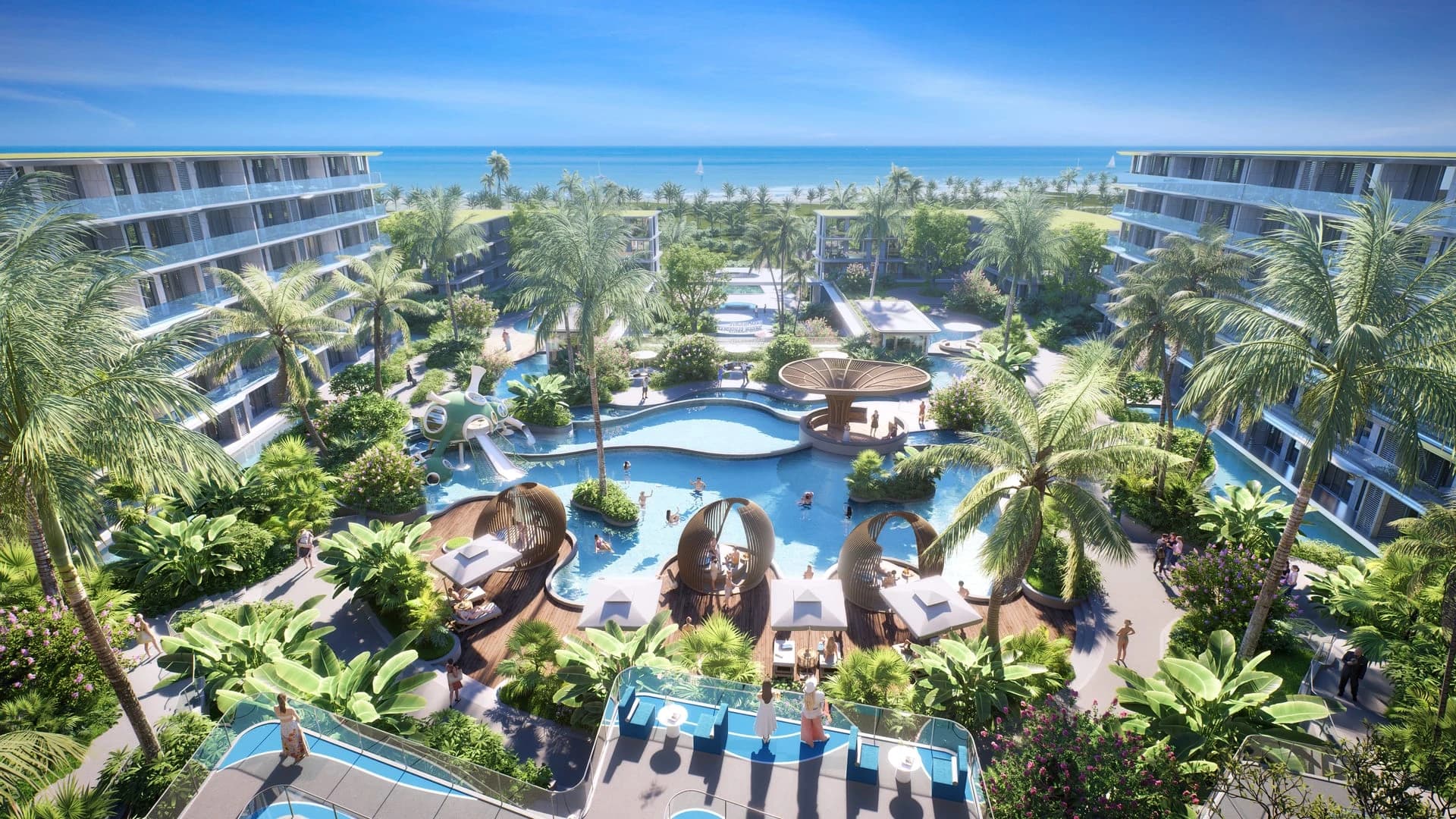 The lagoon pools, palms and loungers between the blocks, looking towards the sea
