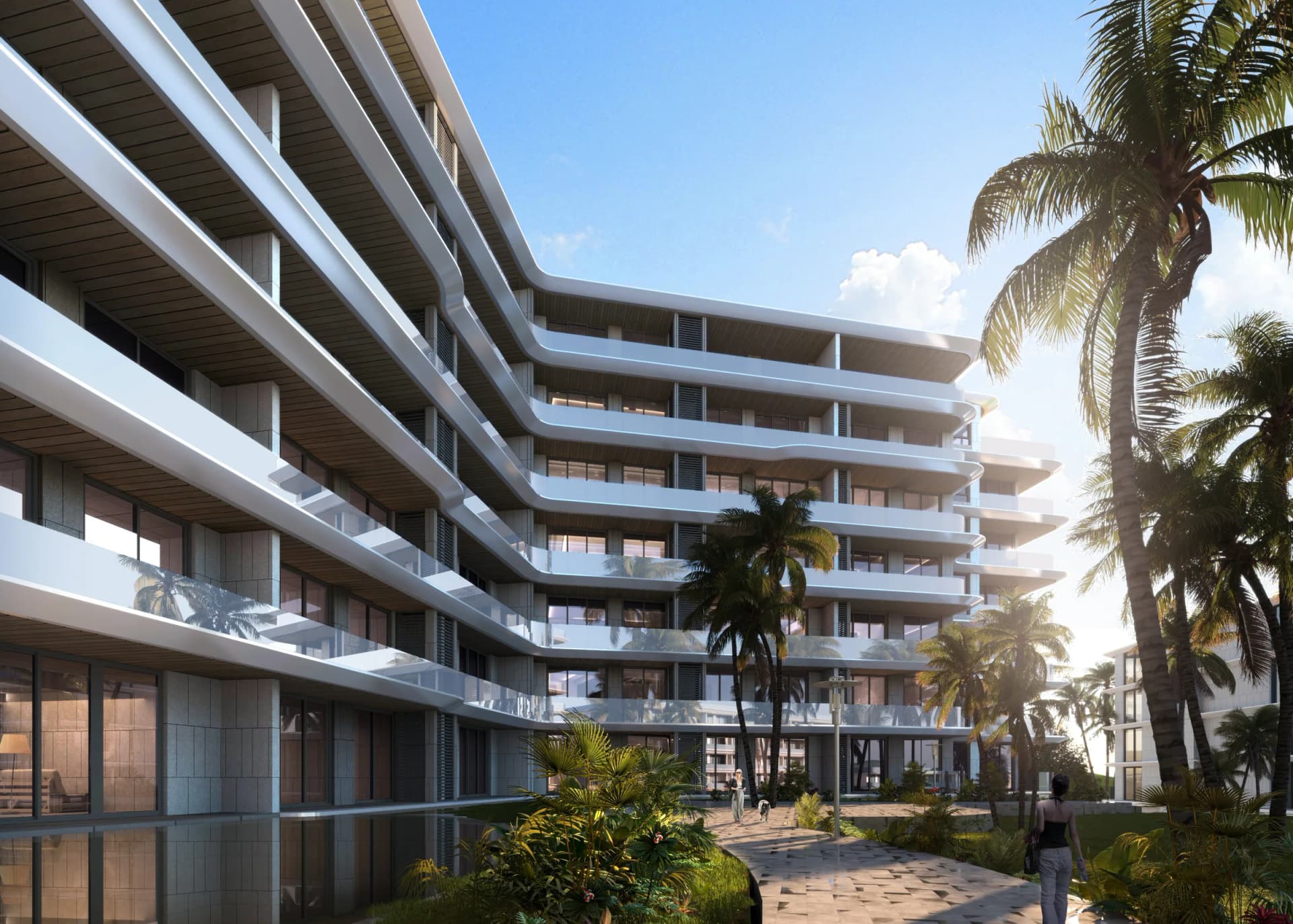 A landscaped courtyard between the stepped balconies of a block